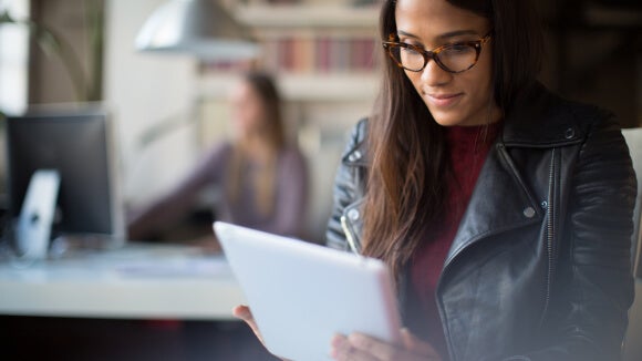 504329864 young-business-woman-with-tablet