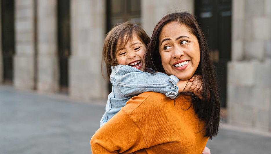 woman with daughter in city center