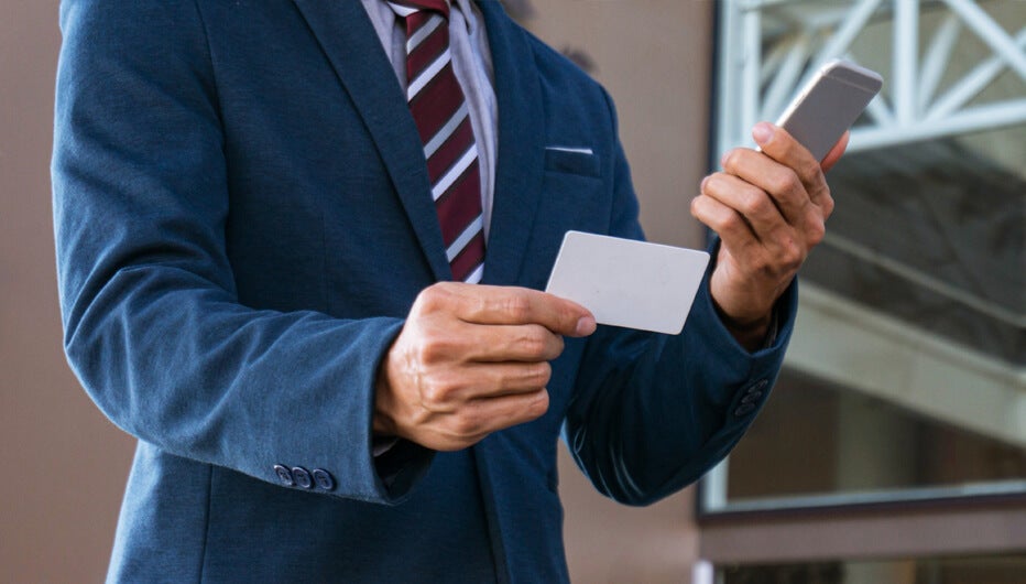 man with a business card phone